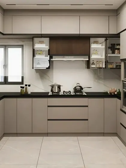 This U-shaped kitchen is designed for maximum efficiency, with a dedicated space for every appliance. The neutral-toned cabinets and black countertops create a timeless and sophisticated look.