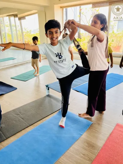 A young yogi beams with pride and focus while practicing Natarajasana. Our Bala Shivir helps children discover their strength and balance in a supportive and encouraging environment.