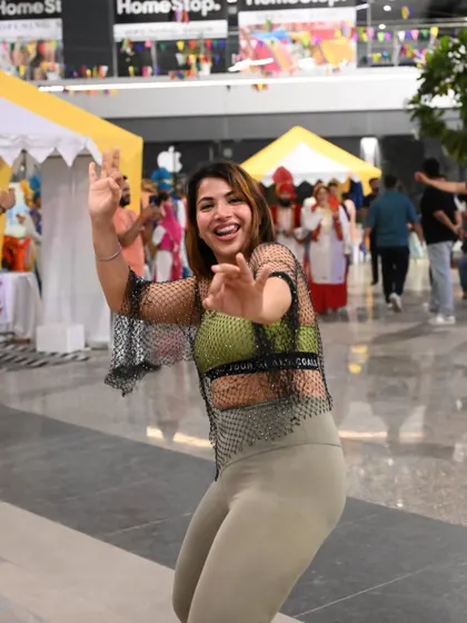 Another shot capturing the vibrant energy of a Zumba flash mob. It's all about having fun while you get fit.