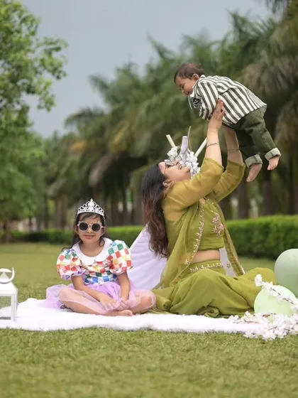 A playful moment between mother and son, with the older sister looking on. I love capturing these candid, joyful interactions during my family photoshoots.