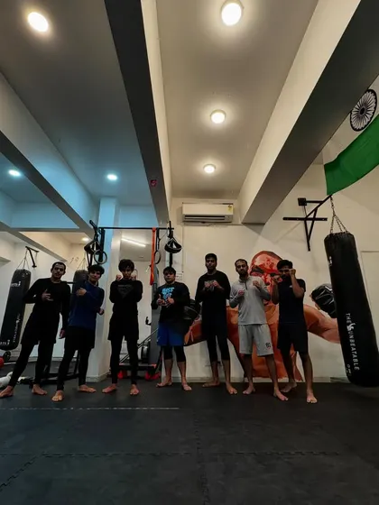 The evening crew posing after a hard session. The bonds forged through tough training are what make our gym a true community.