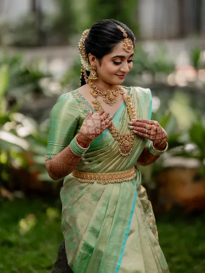 A tender moment between the couple, showcasing their beautiful coordinated outfits. Our goal is to capture the subtle emotions and details that make your wedding portraits special.