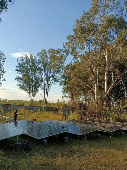 Our team at work setting up the solar array for the Echoes of Earth festival. This ground-mounted system was designed to provide reliable, off-grid power for the stage's lighting and sound equipment.