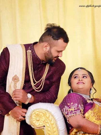 A candid and loving look between the couple on their reception stage. These are the unscripted moments that truly tell the story of their relationship.