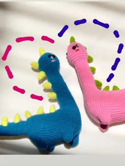 A cute graphic showing the love between the two dino plushies.