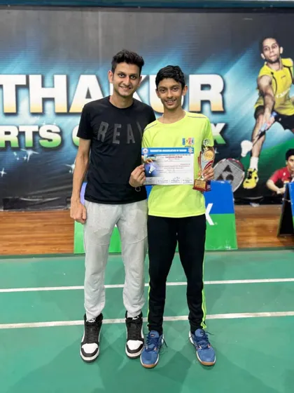 Another look at Pravit and his coach celebrating his district-level achievement. We are there to support our players at every step of their journey.