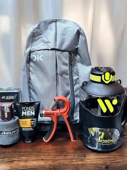 This is a great gift for the gym-goer, featuring a backpack, a large workout water bottle, a hand-strengthening tool, and men's grooming products.