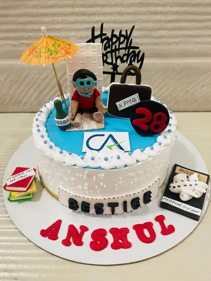 "CA means Can-do Attitude." A personalized cake for a Chartered Accountant, featuring a beach-loving CA relaxing with his briefcase, passport, and books.