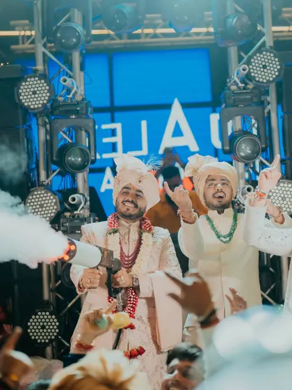 The groom makes a fun, high-energy entrance at the after-party, complete with a CO2 smoke gun. We plan celebrations that last all night long.