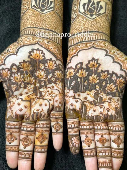 An artistic attempt at traditional Pichwai painting style in henna. This design features holy cows amidst a forest of lotus flowers, creating a unique and spiritual piece of art on the palms.