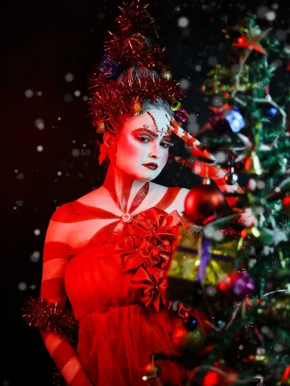 A festive Christmas-themed look, combining creative makeup with a party-ready feel.