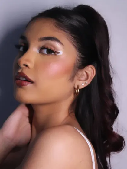 A profile view showing how the graphic liner extends, creating a unique winged effect.
