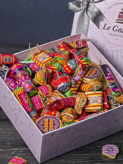 Why burst crackers when you can eat them? Our Diwali Dhamaka Cracker Box is filled with gourmet chocolates shaped like popular firecrackers, in assorted flavours like Rasmalai and Salted Caramel.