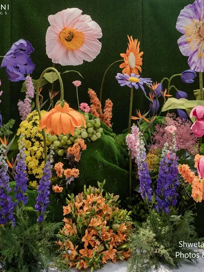 A detailed view of the floral arrangements on the "Bloom" wedding stage, showing the artistry and mix of colors and textures used to create this fantasy garden.