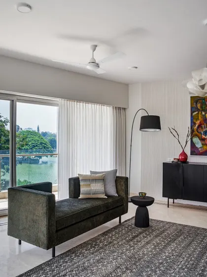 A versatile daybed is one of my favorite pieces of furniture. Here, it frames a beautiful view of the lake, creating a perfect spot for lounging.