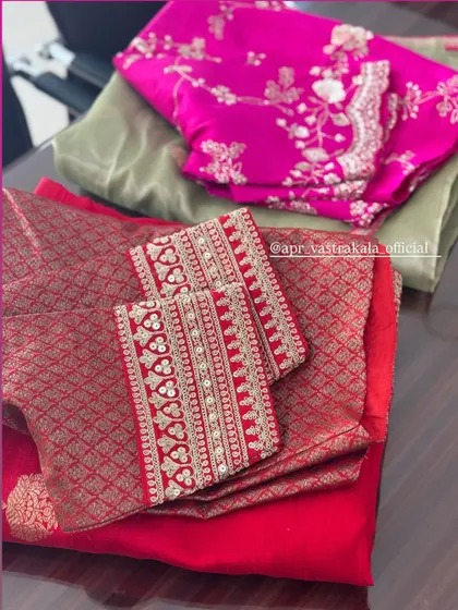 A red and a pink blouse, showing different custom embroidery options.