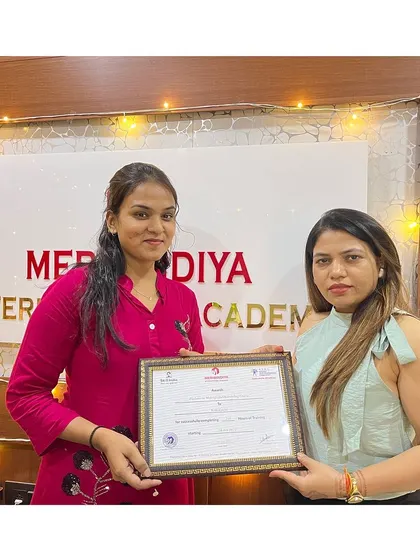 Celebrating success with festive lights in the background. Another graduate ready for a sparkling career.