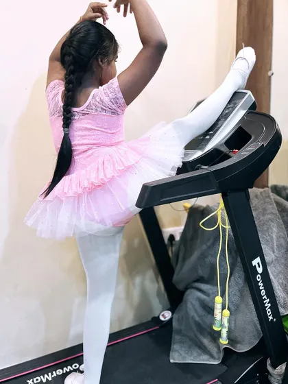 A duplicate of image 87, showing a young dancer's dedication to her practice.