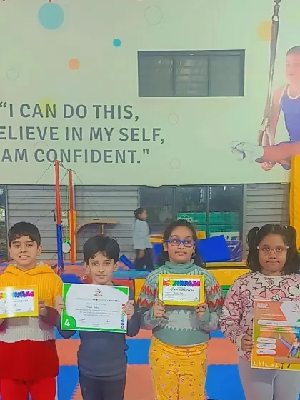 A group of our students proudly displaying their various certificates of achievement.