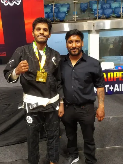 A duplicate of image 75, with my coach after the win.