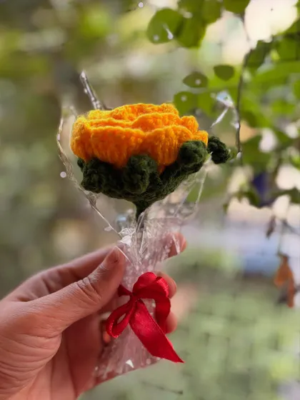 A single yellow rose, symbolizing friendship and joy. The bright color is sure to brighten anyone's day.