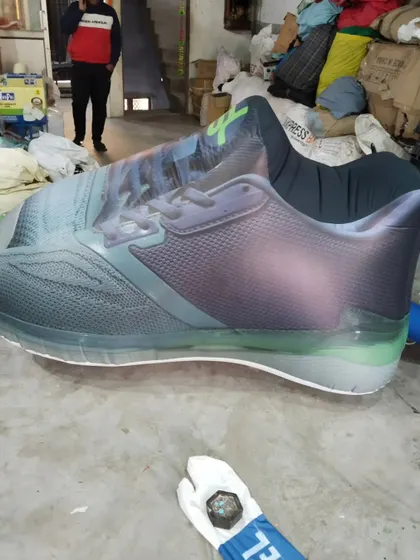 This is a giant inflatable replica of a sports shoe, showing how we can turn any product into a large-scale advertising model.