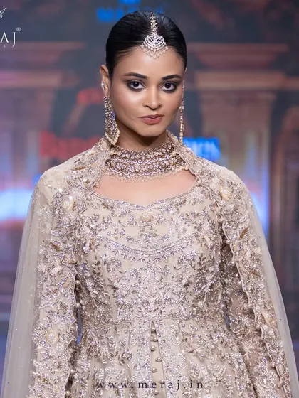 A close-up of the Gold Tail Peplum Indo-Western, highlighting the subtle self-matching embellishments and exotic ornamental designs.