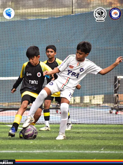A player skillfully maneuvers the ball away from two defenders. This showcases the confidence and composure we build.