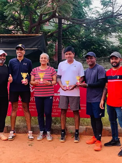 The winners and runners-up from a weekend Just-Am singles and doubles tournament. Our events cater to a diverse group of passionate amateur players.