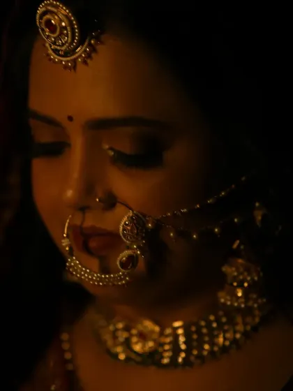 A candid moment captured under warm lighting. You can see how the makeup creates a soft glow on the skin, ensuring you look perfect from every angle, even in low light.