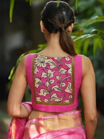 This sleeveless pink blouse has a beautiful hand-painted floral design on the back panel, making it a piece of wearable art.
