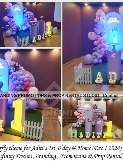 A simple and sweet butterfly theme for a first birthday at home. The setup includes a semi-arch backdrop with a purple and pink balloon garland, themed cylinder props, and a light-up number "1," perfect for an intimate celebration.
