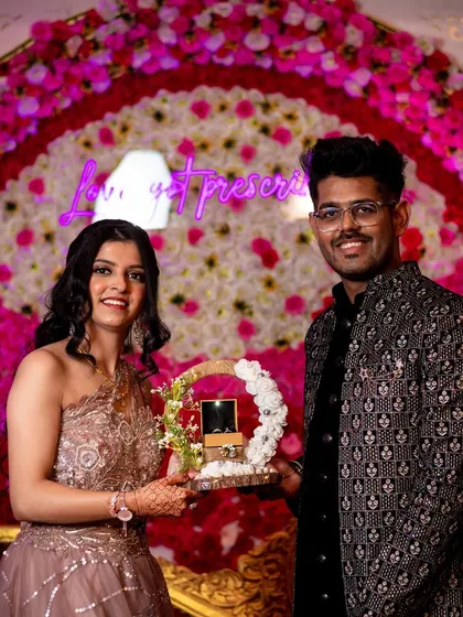 The couple posing with their engagement ring platter. We document all the key moments and details of your ceremony.