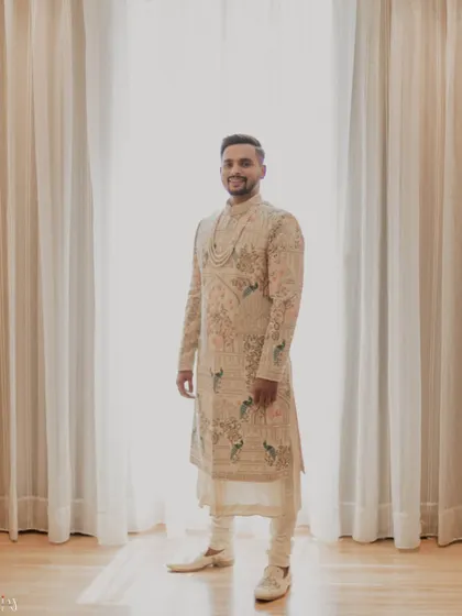 A classic portrait of the groom in his intricately embroidered sherwani.