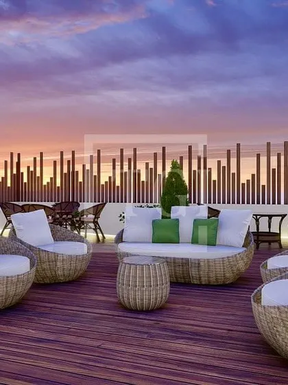 A beautiful evening shot of the wicker seating area from the Noida project, showing how the space transforms at dusk.