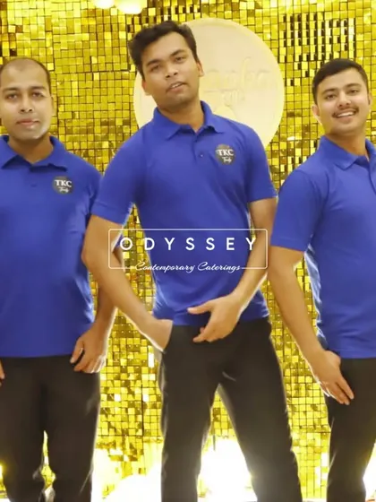 Our fantastic service team posing in front of a festive gold backdrop. Their energy and professionalism are key to creating a fun and seamless event for our clients.