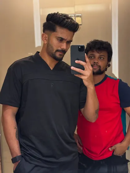 A mirror selfie showing off Nitish Kumar Reddy's sharp new look.