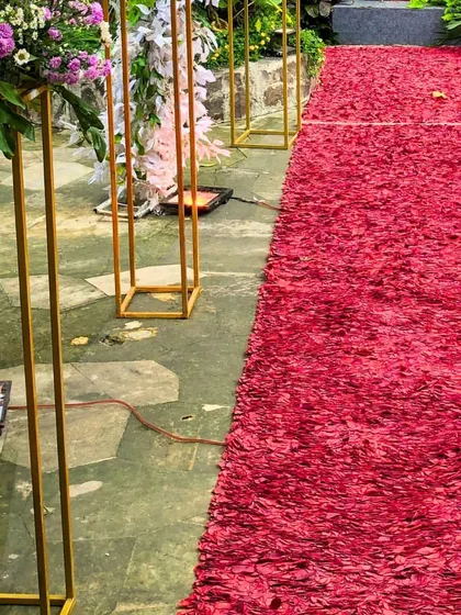A red carpet made of flower petals. This is one of the luxurious details we can add to your event, making the entrance feel incredibly special and grand.