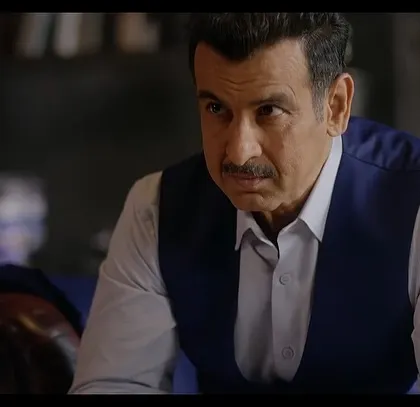 A close-up of Ronit Roy, capturing his intense gaze. The simple, elegant styling ensures that nothing distracts from his powerful performance.