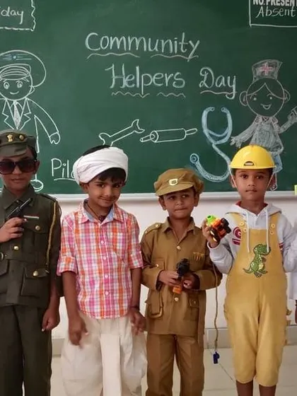 A diverse group of community helpers, including a doctor, soldier, and construction worker, stand together in their creative costumes.