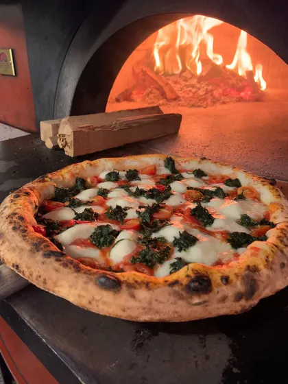 Our Spinach and Garlic pizza, fresh out of the wood-fired oven.