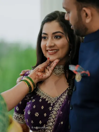 A candid moment showing the flawless finish of this reception makeup. The soft glam look with a subtle shimmer on the eyes looks beautiful in natural light.