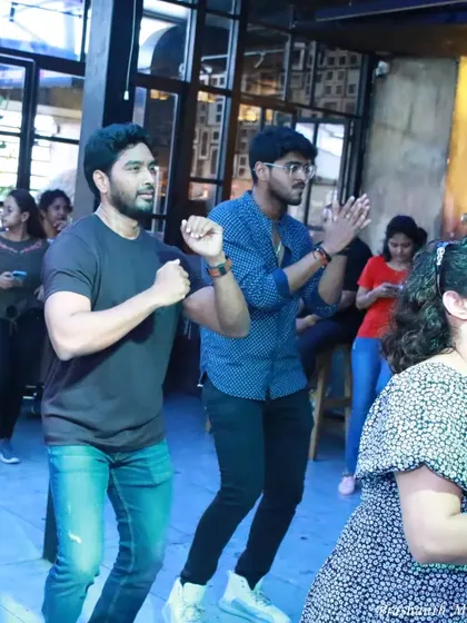 More participants enjoying the synchronized choreography. The sense of community is strong when everyone is moving together to the same rhythm.