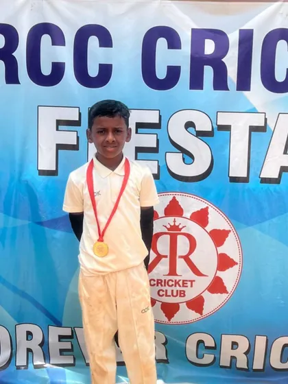 Keerthan with his medal.
