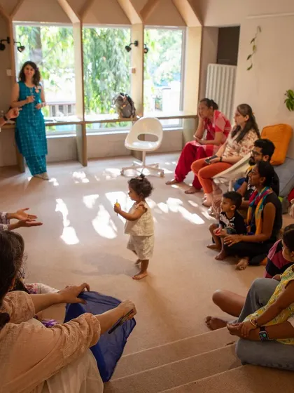 A group of parents and children gathered for a story or activity. This image showcases the community aspect of our events, where families come together to learn and play.
