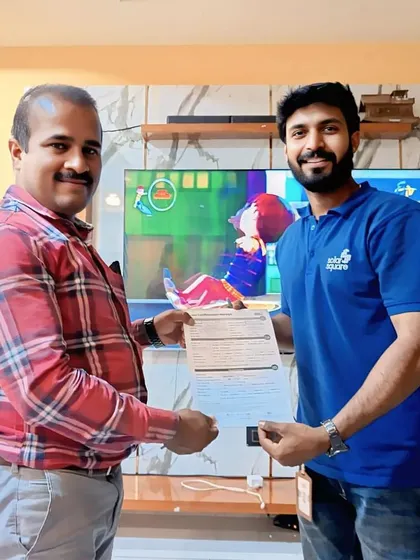 A customer receives his solar agreement from our team member in front of his TV. We bring the consultation to you.