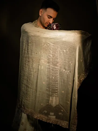 An artistic shot with my sitar veiled by a sheer dupatta, creating a sense of mystery and reverence.