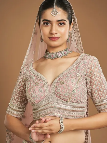 A full view of the modern pastel bride. Learning to balance the makeup with the detailed embroidery and jewelry is a key skill we focus on in the academy.