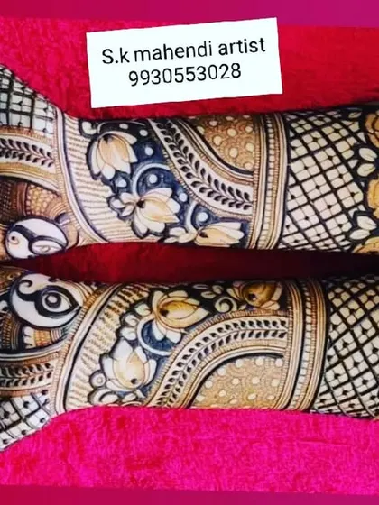 A beautiful design with peacock and floral motifs laid out horizontally. The use of color and shading gives this design a unique, painted look.