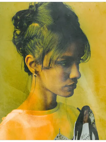 A profile portrait with a yellow and orange color wash, featuring a small collage element. The image has a grainy, vintage feel, suggesting the long history of media's influence on style.